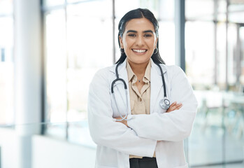 Poster - Portrait, woman and healthcare with confident in hospital of medical service, diagnosis advice and career pride. Smile, surgeon and arms crossed for trust, about us and medicine treatment of wellness