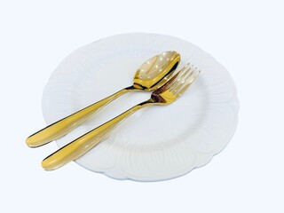  a simple yet elegant table setting with a white ceramic plate and a pair of golden utensils, including a fork and spoon.