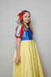 © millaf - Cute kid girl theater actress in SnowWhite costume smiling standing on white background