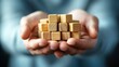 © Sandu - Hands Holding Wooden Blocks