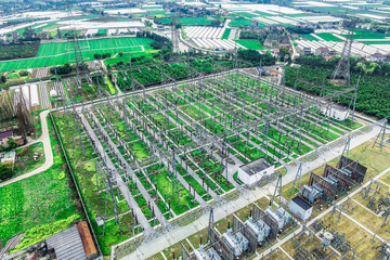 Wall Mural - Aerial view of high voltage substation electricity tower industrial equipment landscape