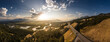 © AmazingAerialAgency - Aerial view of a tranquil sunset over the expansive wetlands and winding Columbia River surrounded by majestic mountains and serene forests, Invermere, Canada.