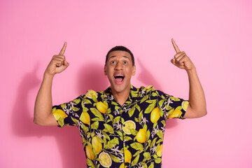 Canvas Print - Photo portrait of pretty young male point look up empty space wear trendy tropical print outfit isolated on pink color background