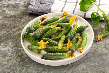 Raw gherkin cucumbers in the bowl