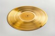 © Vii - A gold record sitting on top of a white surface
