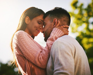 Sticker - Forehead, hug and couple with love, outdoor and bonding on date, affection and happy for commitment. Smile, man and woman in relationship, trust and embrace for romance, relax and together in weekend