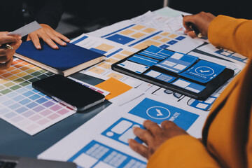 The designer team is designing the uxui system to make the uxui system work well on new phones and support system updates. Website development concept UI UX front end designer