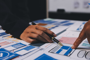 The designer team is designing the uxui system to make the uxui system work well on new phones and support system updates. Website development concept UI UX front end designer