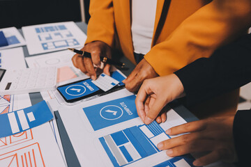 The designer team is designing the uxui system to make the uxui system work well on new phones and support system updates. Website development concept UI UX front end designer