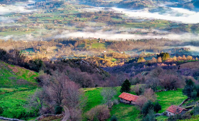 Wall Mural - Ovin and Buyeres under the fog, seen from Sierra de Peñamayor Nava, Asturias, Spain