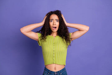 Wall Mural - Photo portrait of pretty teen girl touch head scared wear trendy green outfit isolated on purple color background