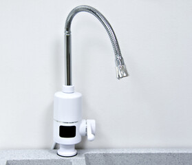 Chrome faucet with modern sink