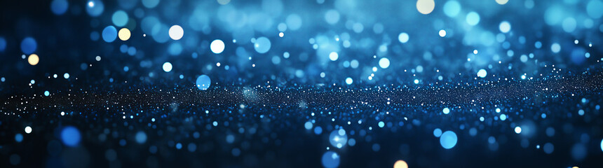 A shimmering blue bokeh background with various sizes of glowing lights, creating a festive and magical sparkling effect