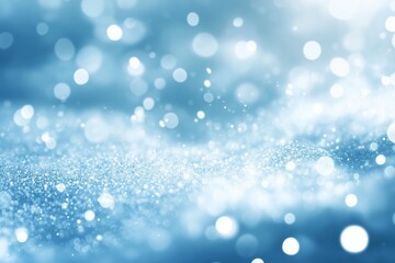 Abstract winter background with a vibrant blue color, with snow and blurred background with bokeh lights.