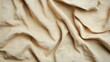 © tanapat - Wavy beige fabric texture on white background, ideal for design projects.