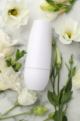 Poster - Roll-on deodorant and beautiful eustoma flowers on white marble table, flat lay