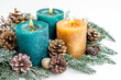 © chandlervid85 - Candle with christmas decoration isolated on white background
