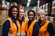 © NikoG - Smiling portrait of a diverse group of female warehouse workers