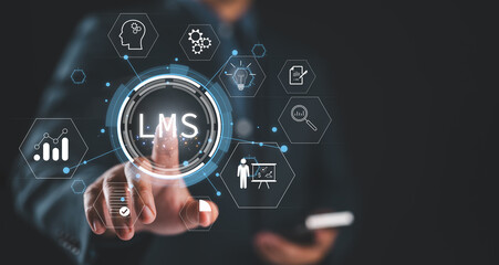 Learning management system concept. Businessman touching virtual screen of LMS or Learning management system icon. Lesson and online education, course, application, education and e learning.