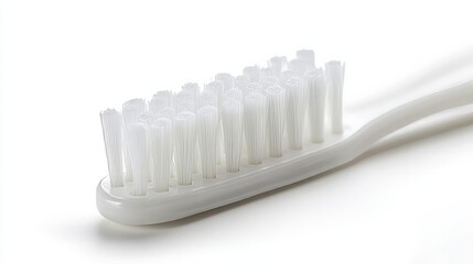 A close-up of a toothbrush with angled bristles, designed for cleaning between teeth, isolated on white background