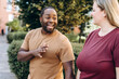 © Maria Vitkovska - Funny African American man dating with plus size woman in the city