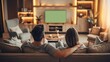 © Arusha - Couple Relaxing on Sofa Watching Television at Home