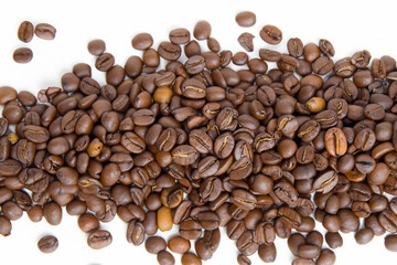 Coffee beans in a white. Caffeine drink closeup concept. A strip of brown coffee beans on white . A strip of brown coffee beans on a lifestyle white.