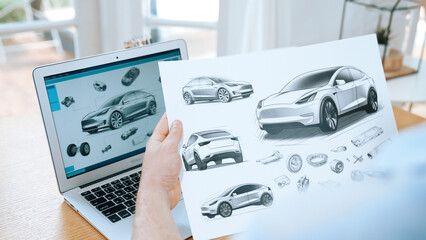 Car design engineer analyze car prototype for automobile business at home office. Automotive engineering designer carefully analyze, finding flaws and improvement for car design with laptop Synchronos