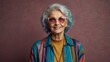 © muqadas - Happy funny cool senior woman with colorful hairs and in trendy clothes portrait on color background, stylish grandma, concepts about lifestyle, seniority and old people