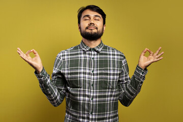 man making OK sign with both hands, eyes closed