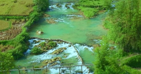 Wall Mural - Aerial view of The green river flows through the villages and rice fields.
Aerial top view of amazing Yellow and green rice terraces
beautiful sky in sunrise above the mountains 