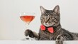 © Budsadee - Charming cat dressed in a bow tie, enjoying a fancy drink, portraying a humorous take on luxury, against a white setting