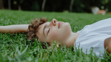 Youth Relaxing on Grass in Natural Setting