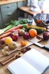 Wall Mural - An assortment of cooking ingredients and utensils on a wooden table, including vegetables, fruits, spices, and a notebook