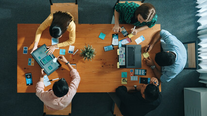 Top view of developer and designer shake hand together at meeting. Software developer handshake and working together with programmer to develop Ux Ui desifn for mobile phone interface. Convocation.