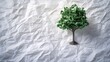 © 69 - A green tree growing on crumpled paper, a fusion of nature and artistic expression, symbolizing sustainable creativity