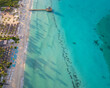 © robertobinetti70 - Bayahibe beach aerial photo by drone. Crystal clear sea with beautiful beach and romantic pier.Dominican Republic.