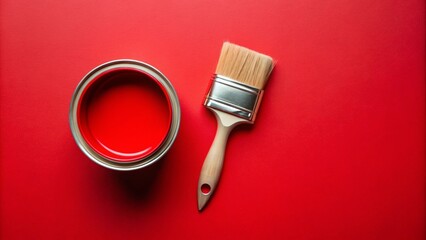 Paint can and brush on red background, top view
