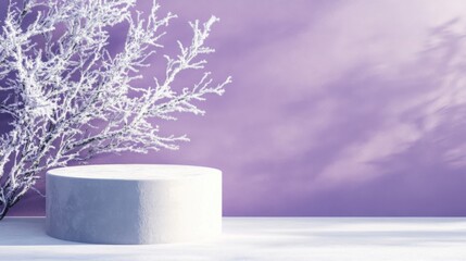 Aufkleber - A snowy tree stands beside a circular pedestal on a light surface, creating a serene winter ambiance. The purple backdrop adds a soft, dreamy quality to the daylight setting.