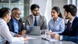 © N7 - Indian financial advisors discussing client portfolios in a meeting.