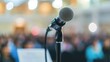 © Steve - Close-up of microphone on stand in soundproof recording studio, positioned in front of script stand, symbolizing voice acting and audio production.