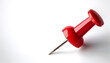 © Saddha Visual - A single bright red push pin with a metallic needle on side position provides copy space for text. background concept isolated white