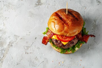 Top view of delicious homemade burger with beef and toppings.