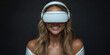 © Keopaserth - woman with long blond hair is smiling while wearing virtual reality headset, creating futuristic and immersive experience. dark background enhances focus on her expression