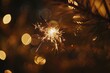 © shobakhul - A Single Sparkler Burning Bright Against a Background of Golden Bokeh Lights