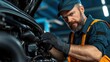 © angel_nt - Mechanic working on the engine of a car in a garage, highlighting the technical skills and hands-on expertise required in auto repair