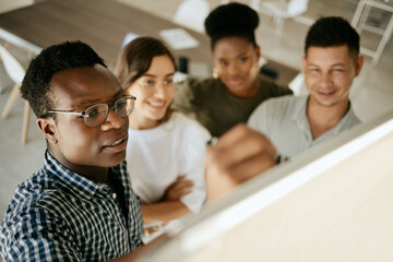 Poster - Presentation, business man and writing on board with team for planning, learning and problem solving. Manager, whiteboard and brainstorming solution, ideas and project development in creative startup