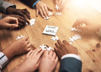 Aufkleber - Teamwork, puzzle and hands of business people in collaboration in a meeting together planning strategy at work. Circle, professional and group in a table with synergy as a workforce for innovation