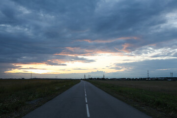 Wall Mural - beautiful cloudy sky over highway in countryside