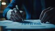 © Business Pics - Businessman analyzing financial data and graphs with a pen. Professional setting focusing on performance and strategy.
